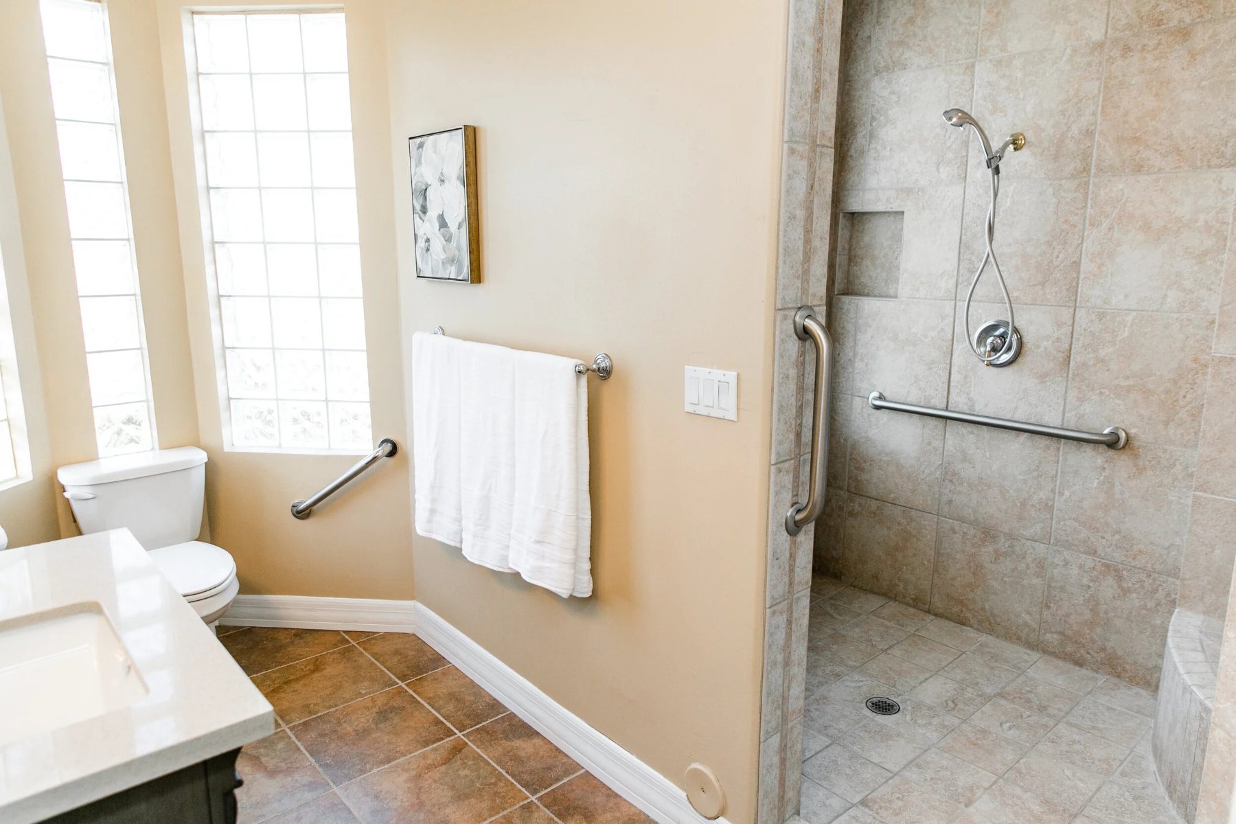 Accessible bathroom with a roll-in shower and grab bars