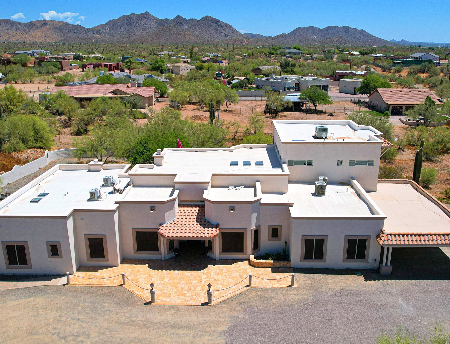 The Desert Hills House from above, with the mountains behind it